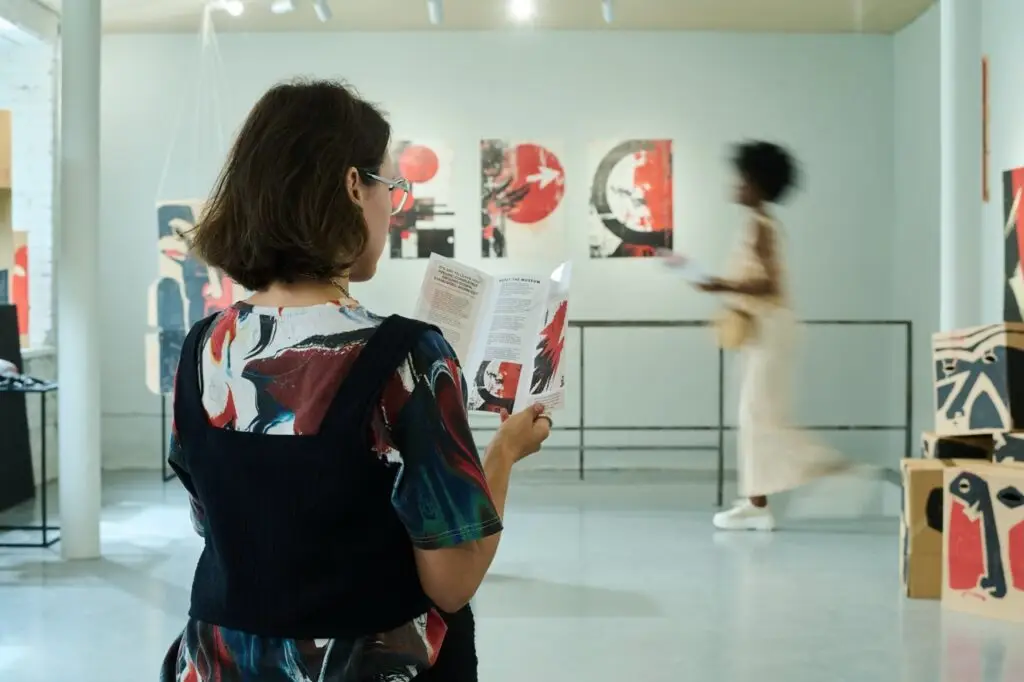 Woman reading about fine art valuations Adelaide